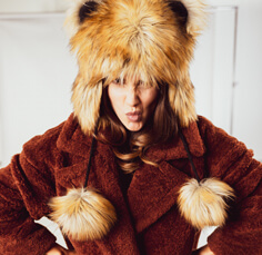 Portrait of a woman wearing a fancy fake fur hat